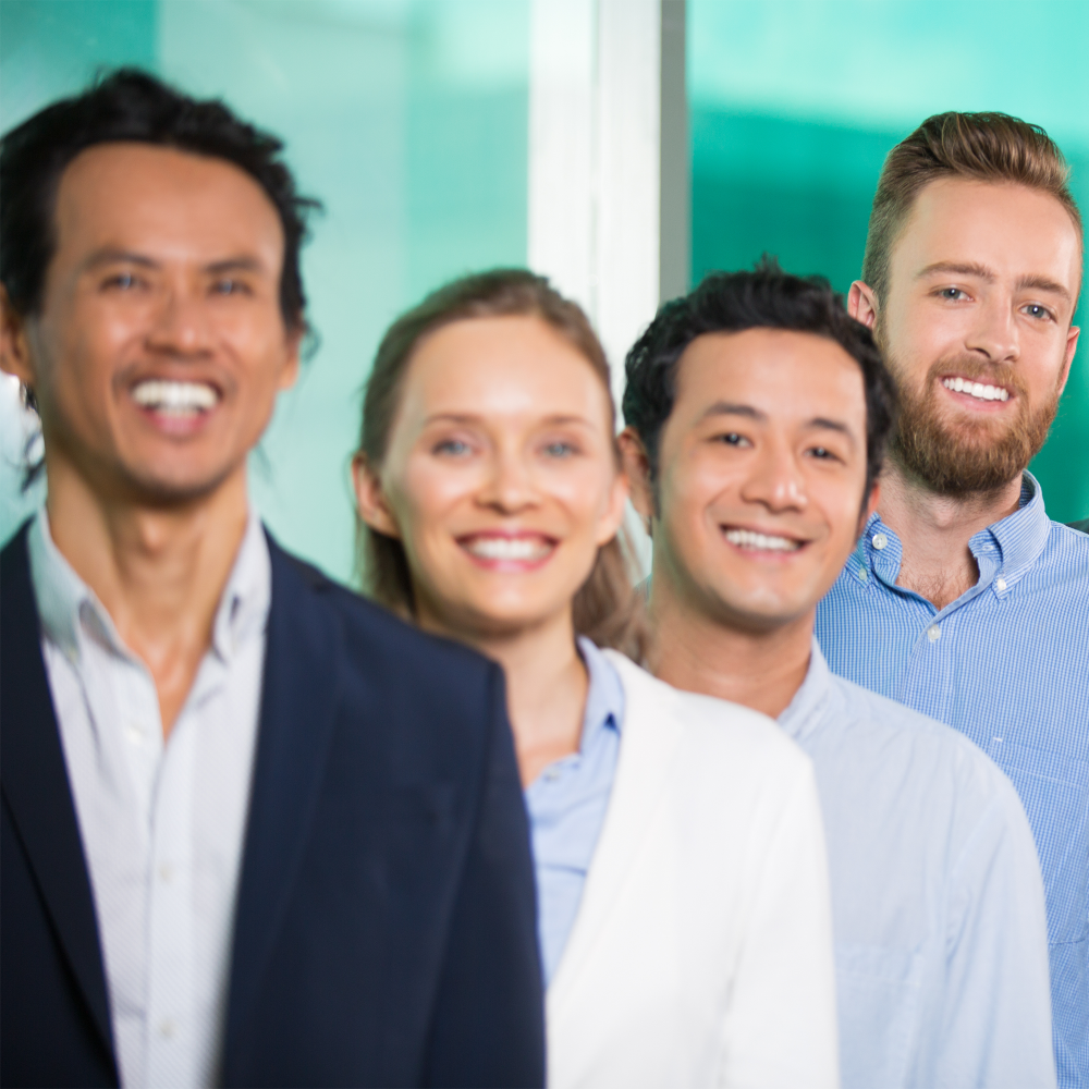 successful-smiling-business-people-standing-row